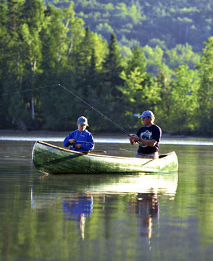 Two men in a canoe fishing